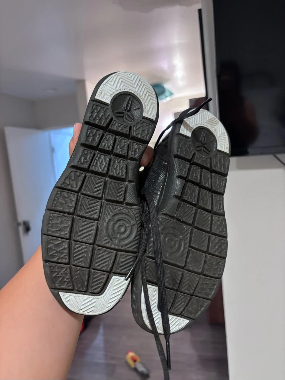 Nike Kids Black Sneakers with Gold Swoosh and Purple Heel